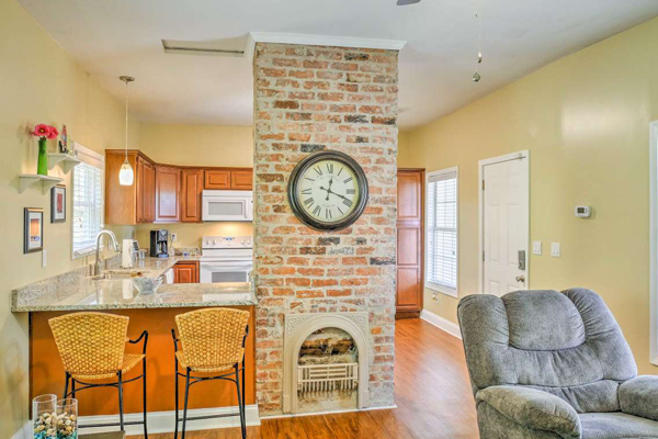 living room with fireplace and bar-height counter top